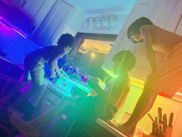Kids and colorful lighting in the kitchen